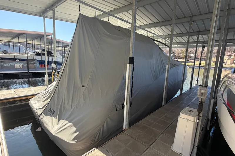 Slide: The Image of Covered 2014 Sea Ray 370 Sundancer docked in a marina. - 64