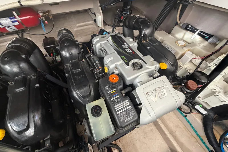 Slide: The Image of Engine compartment of a 2014 Sea Ray 370 Sundancer with a big block V8 engine. - 72