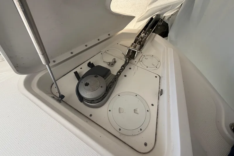 Slide: The Image of Anchor compartment of 2014 Sea Ray 370 Sundancer with windlass and chain. - 9