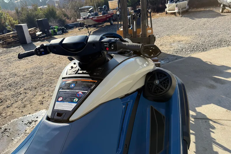 Slide: The Image of 2025 Yamaha WaveRunner FX Limited SVHO, blue and white, parked outdoors. - 7