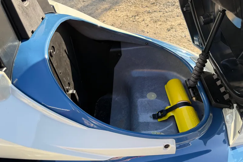 Slide: The Image of Open storage compartment of 2025 Yamaha WaveRunner FX Limited SVHO with yellow accessory inside. - 9