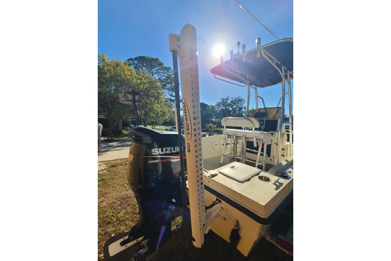 Slide: The Image of 1994 Key West 1900 Sportsman boat with Suzuki outboard motor in sunny outdoor setting. - 16