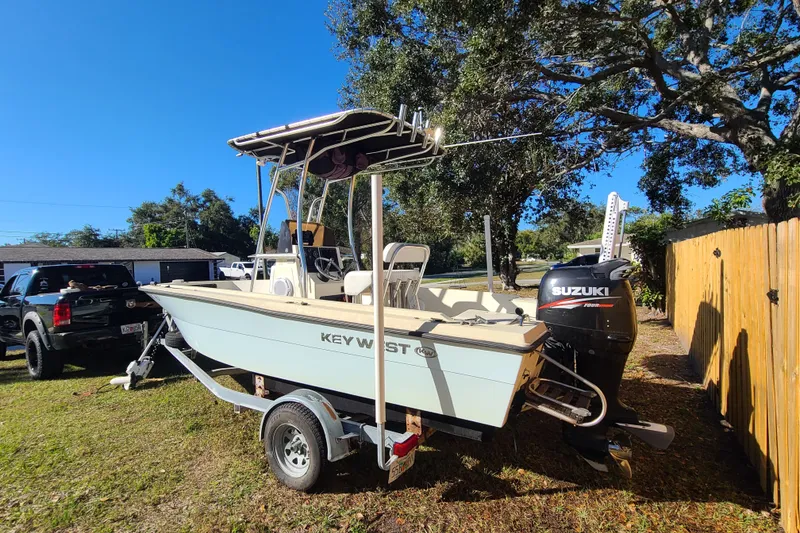 Slide: The Image of 1994 Key West 1900 Sportsman boat on trailer with Suzuki outboard motor. - 2
