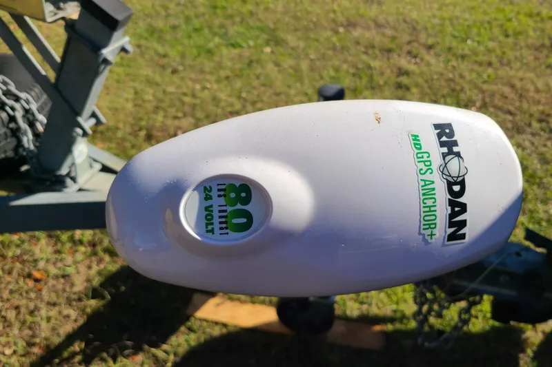 Slide: The Image of Rhodan HD GPS Anchor on Key West 1900 Sportsman, 1994 model, in grassy area. - 20