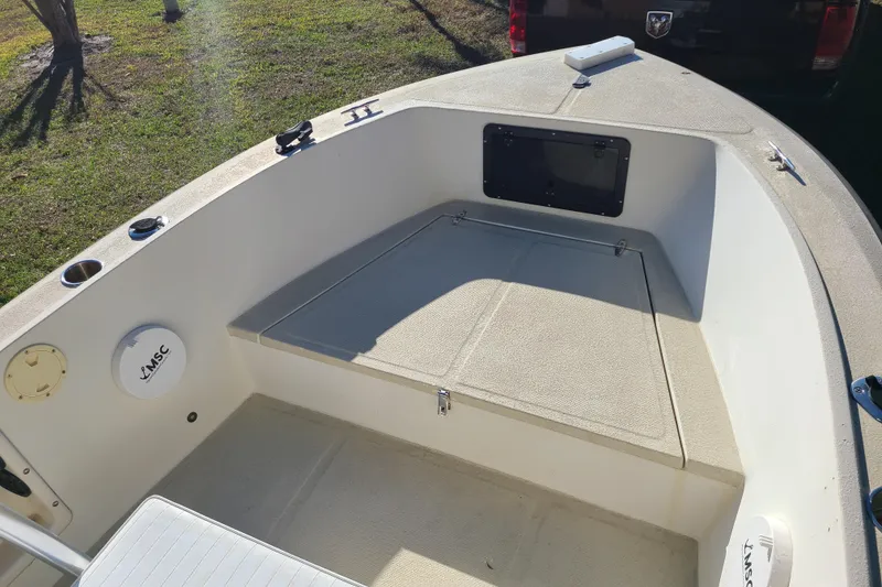 Slide: The Image of 1994 Key West 1900 Sportsman boat interior with seating and storage compartments. - 3