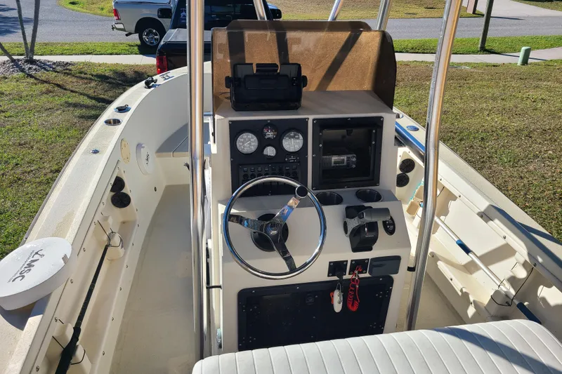 Slide: The Image of 1994 Key West 1900 Sportsman boat interior with steering wheel and control panel. - 6