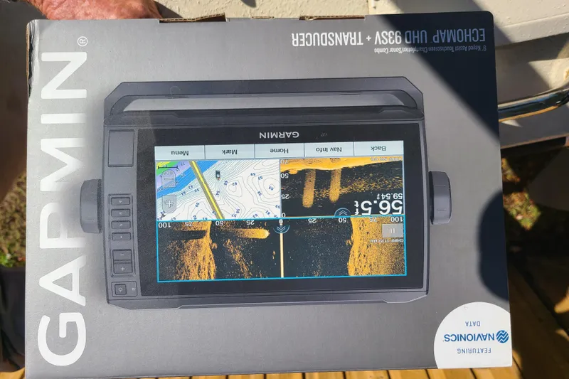 Slide: The Image of Garmin Echomap UHD 93SV transducer box with Navionics data, held outdoors. - 8