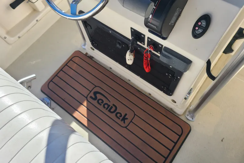 Slide: The Image of Interior of 1994 Key West 1900 Sportsman boat with SeaDek flooring. - 9