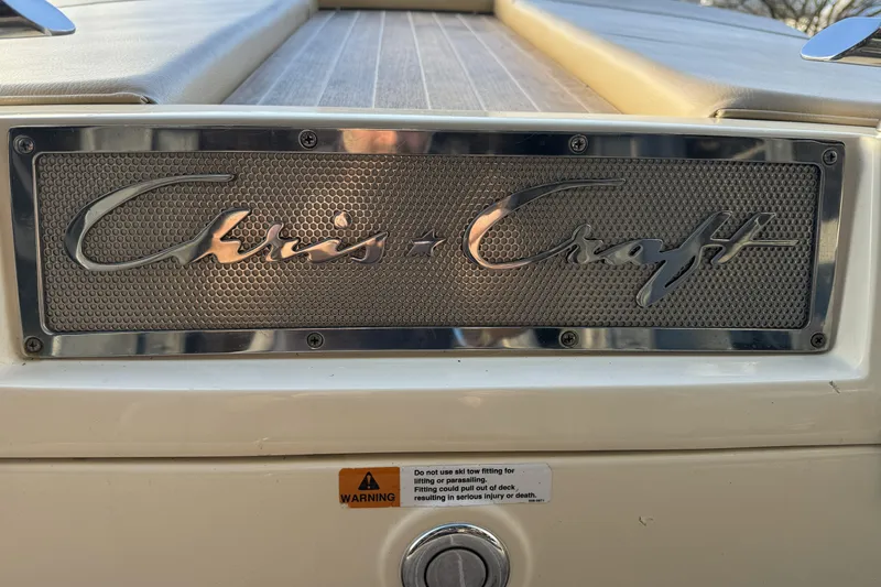Slide: The Image of 2016 Chris-Craft Corsair 25 boat emblem with warning label. - 13