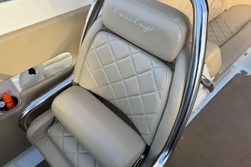 Slide: The Image of Luxurious 2016 Chris-Craft Corsair 25 boat seat with quilted leather and chrome accents. - 19