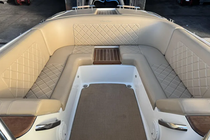 Slide: The Image of Luxurious interior of 2016 Chris-Craft Corsair 25 with beige diamond-stitched seating. - 23