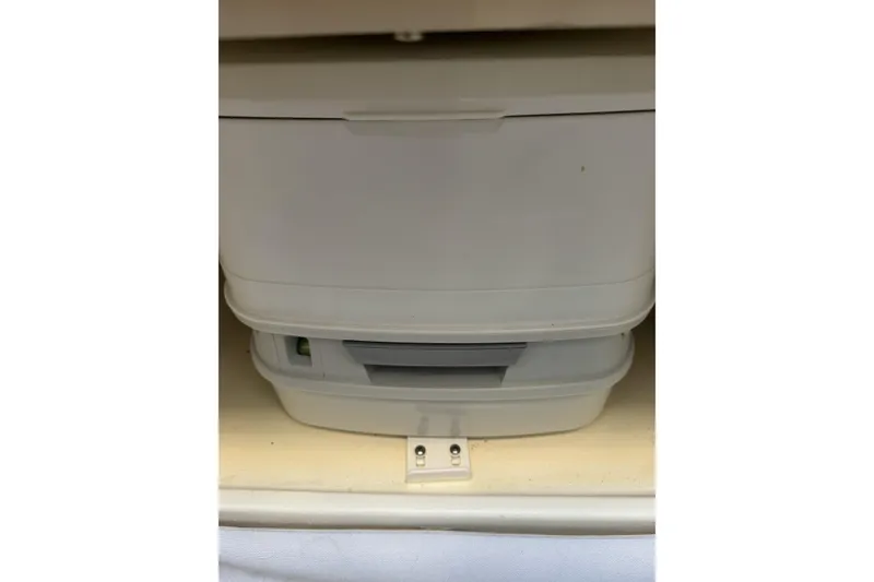 Slide: The Image of Storage compartments inside a 2016 Chris-Craft Corsair 25 boat. - 29