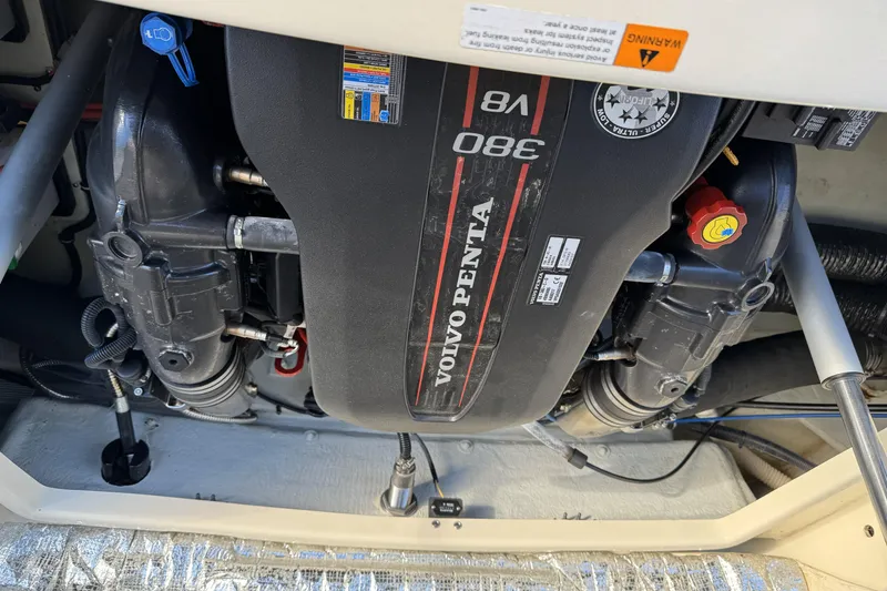 Slide: The Image of 2016 Chris-Craft Corsair 25 engine compartment with Volvo Penta V8 380 engine. - 32