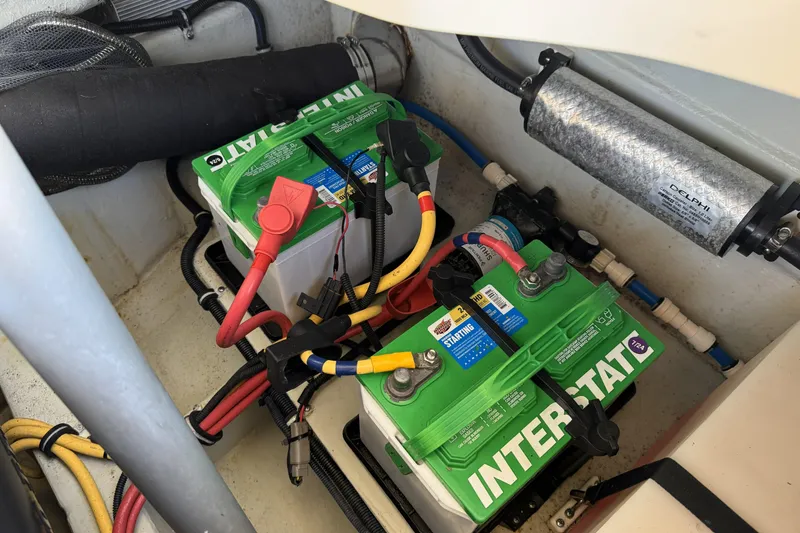 Slide: The Image of Engine compartment of 2016 Chris-Craft Corsair 25 with Interstate batteries and wiring. - 35