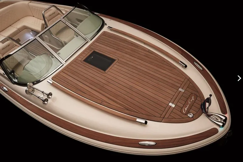 Slide: The Image of Manufacturer Provided Image: 2016 Chris-Craft Corsair 25 boat with elegant wooden deck and luxurious seating. - 5