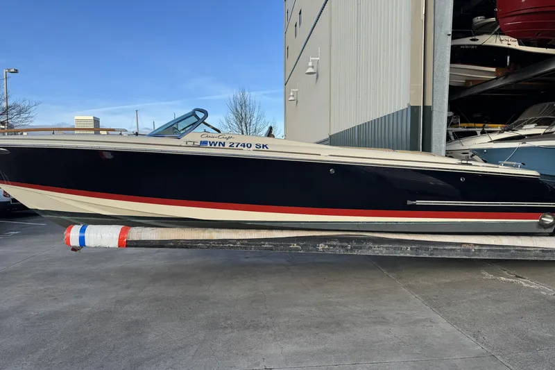 Slide: The Image of 2016 Chris-Craft Corsair 25 boat in storage, side view. - 8