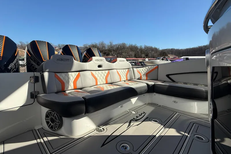 Slide: The Image of 2017 MTI 42V boat interior with stylish seating and powerful engines in a scenic setting. - 11