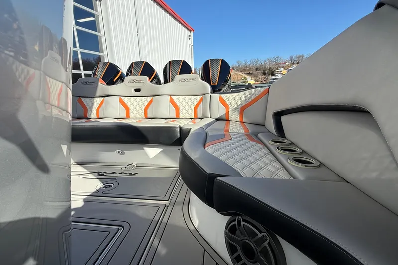 Slide: The Image of 2017 MTI 42V boat interior with stylish seating and cup holders. - 12