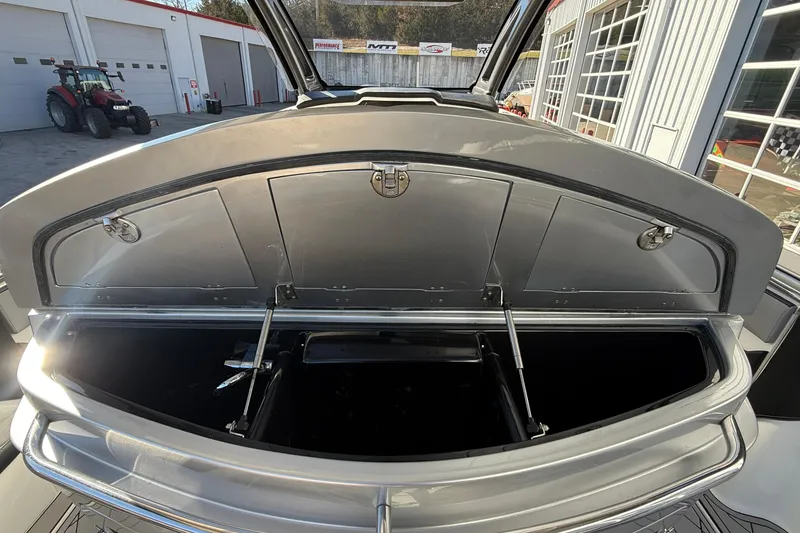 Slide: The Image of Open storage compartment of 2017 MTI 42V boat at a marina. - 13