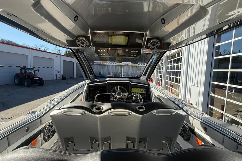 Slide: The Image of Interior view of a 2017 MTI 42V boat with modern dashboard and seating. - 14