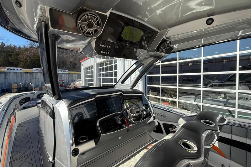 Slide: The Image of Interior of a 2017 MTI 42V boat with advanced navigation system and luxury seating. - 15