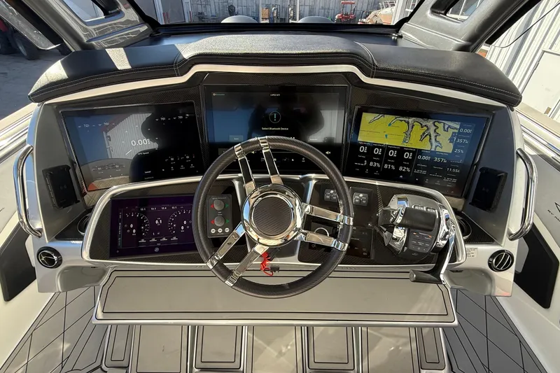 Slide: The Image of Dashboard of a 2017 MTI 42V boat with advanced navigation displays. - 17