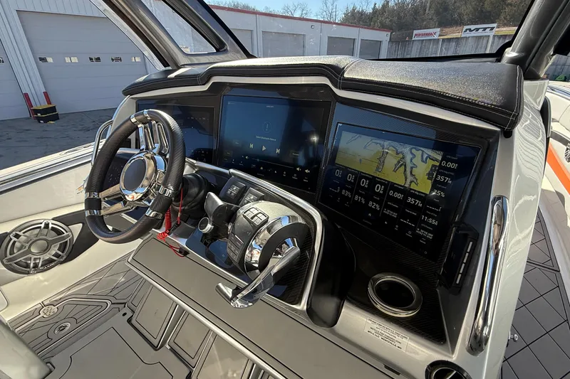 Slide: The Image of 2017 MTI 42V boat dashboard with dual screens and modern controls. - 18