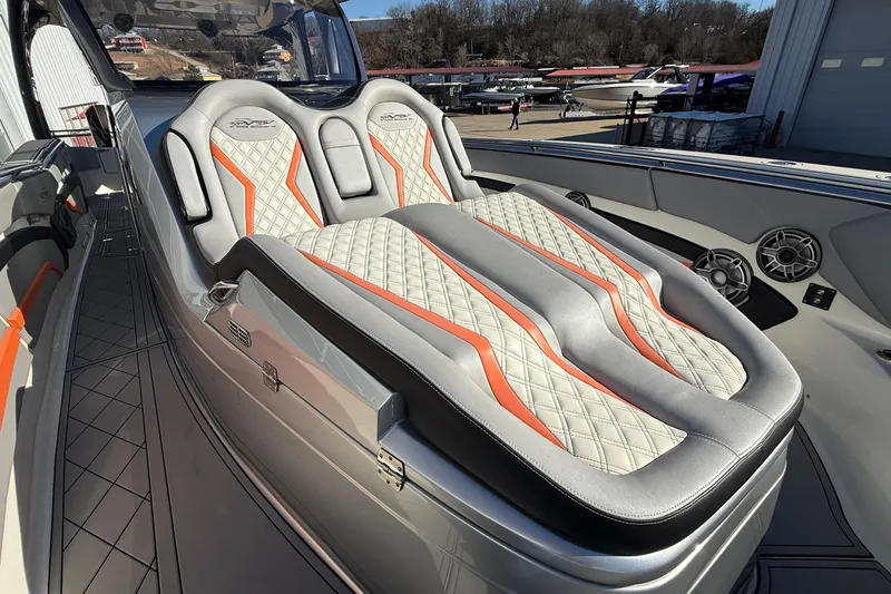 Slide: The Image of Luxurious MTI 42V 2017 boat interior with stylish quilted seats and vibrant orange accents. - 26