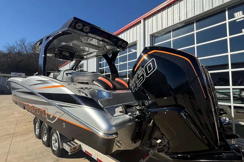 Slide: The Image of 2017 MTI 42V boat with powerful engine, sleek design, and modern features. - 7