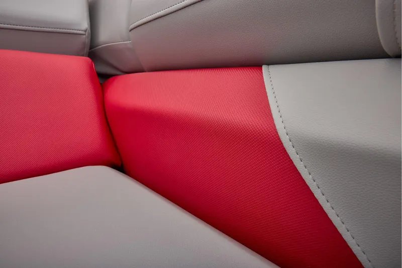 Slide: The Image of Manufacturer Provided Image: Close-up of red and gray upholstery on 2026 Sun Tracker Party Barge 22 DLX. - 48