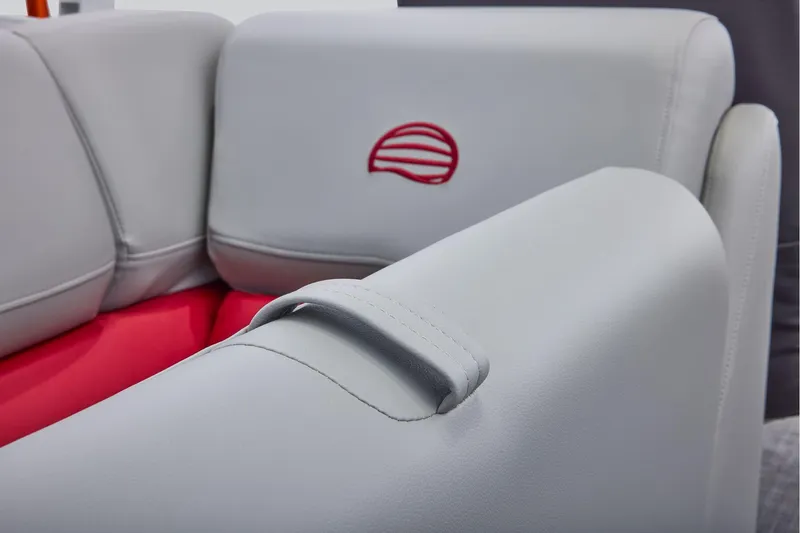Slide: The Image of Manufacturer Provided Image: 2026 Sun Tracker Party Barge 22 DLX interior with gray and red seating detail. - 50