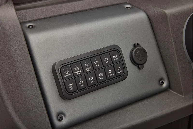 Slide: The Image of Manufacturer Provided Image: Control panel of 2026 Sun Tracker Party Barge 22 DLX with USB port and various switches. - 57