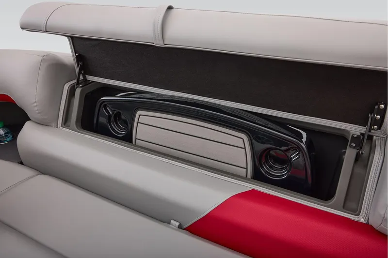 Slide: The Image of Manufacturer Provided Image: 2026 Sun Tracker Party Barge 22 DLX storage compartment with integrated speaker system. - 68