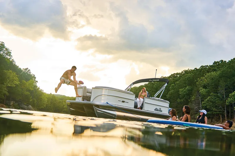 Slide: The Image of Manufacturer Provided Image: 2026 Sun Tracker Party Barge 22 XP3 on a lake with people enjoying water activities. - 16