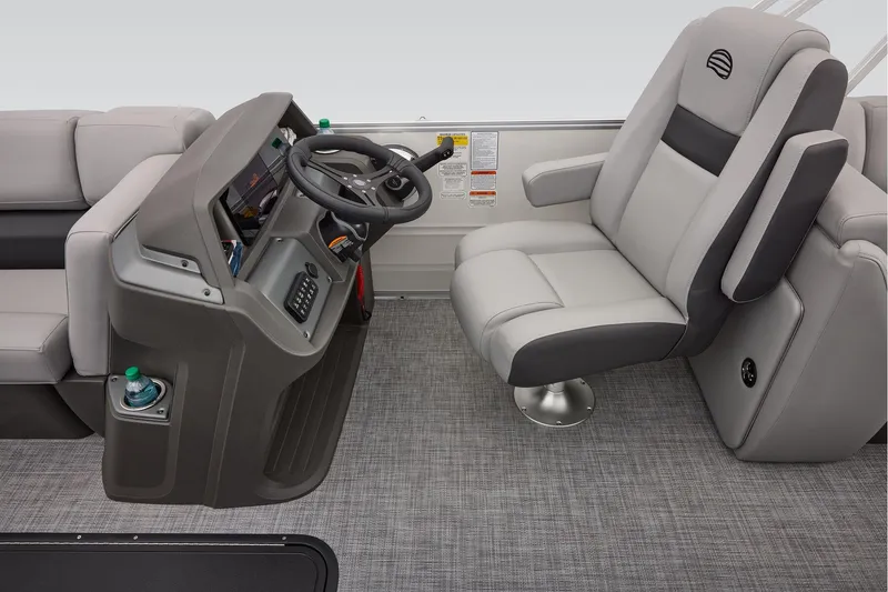 Slide: The Image of Manufacturer Provided Image: 2026 Sun Tracker Party Barge 22 XP3 interior with captain's chair and steering console. - 48