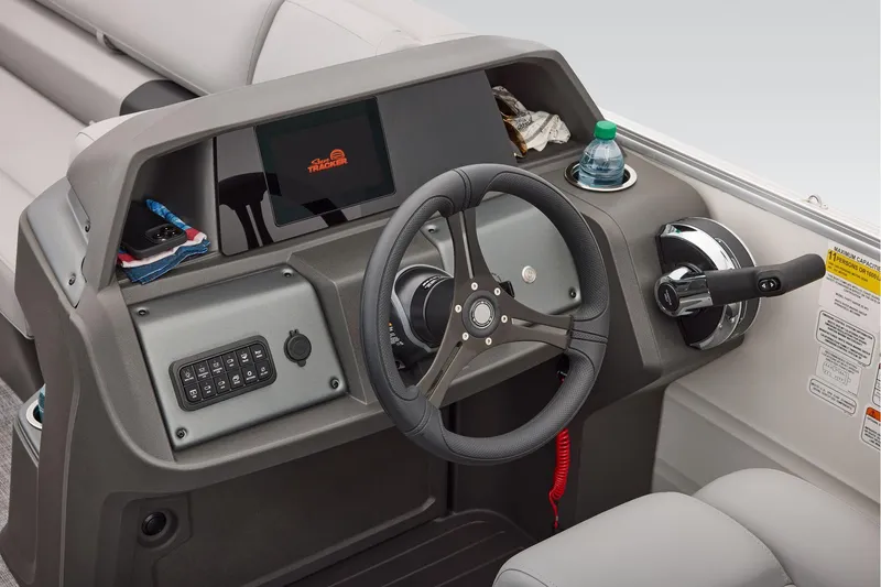 Slide: The Image of Manufacturer Provided Image: 2026 Sun Tracker Party Barge 22 XP3 helm with steering wheel and control panel. - 50