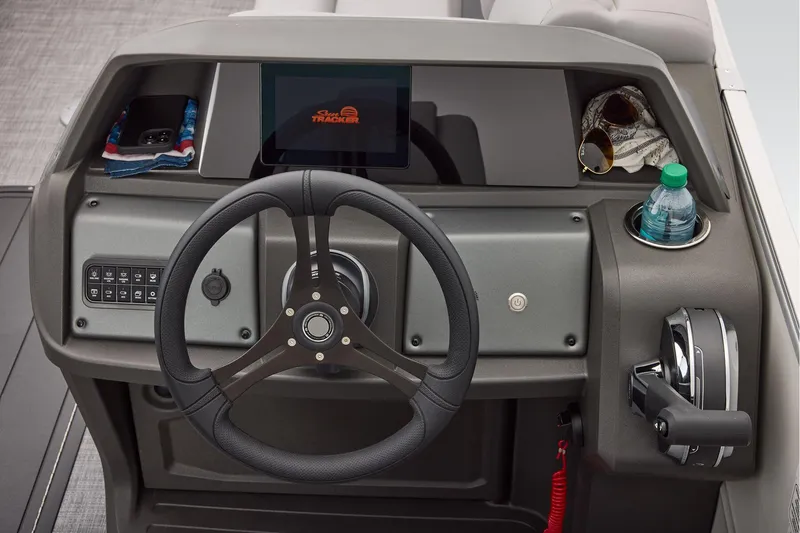 Slide: The Image of Manufacturer Provided Image: 2026 Sun Tracker Party Barge 22 XP3 helm with steering wheel and control panel. - 51