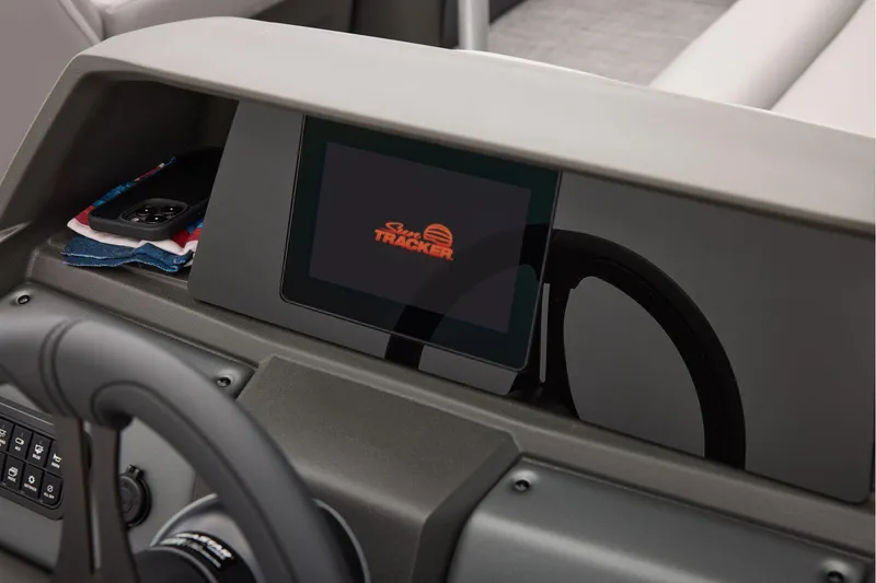 Slide: The Image of Manufacturer Provided Image: Dashboard of 2026 Sun Tracker Party Barge 22 XP3 with steering wheel and display. - 55