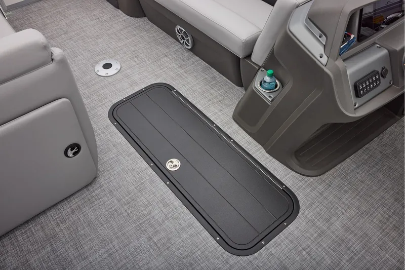 Slide: The Image of Manufacturer Provided Image: 2026 Sun Tracker Party Barge 22 XP3 interior with gray seating and storage compartment. - 58