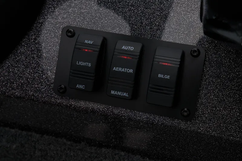 Slide: The Image of Manufacturer Provided Image: Manufacturer Provided Image: Control panel of 2025 Ranger VS1665SC boat with switches for lights, aerator, and bilge. - 29