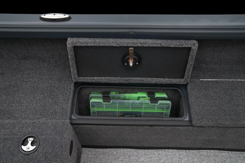 Slide: The Image of Manufacturer Provided Image: Manufacturer Provided Image: Storage compartment in 2025 Ranger VS1665SC boat with green tackle box. - 32