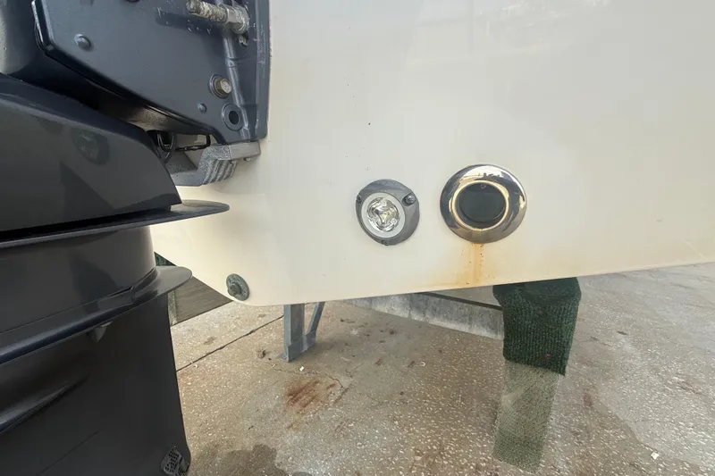 Slide: The Image of 2022 Sportsman Open 232 Center Console boat stern with engine and fittings. - 18