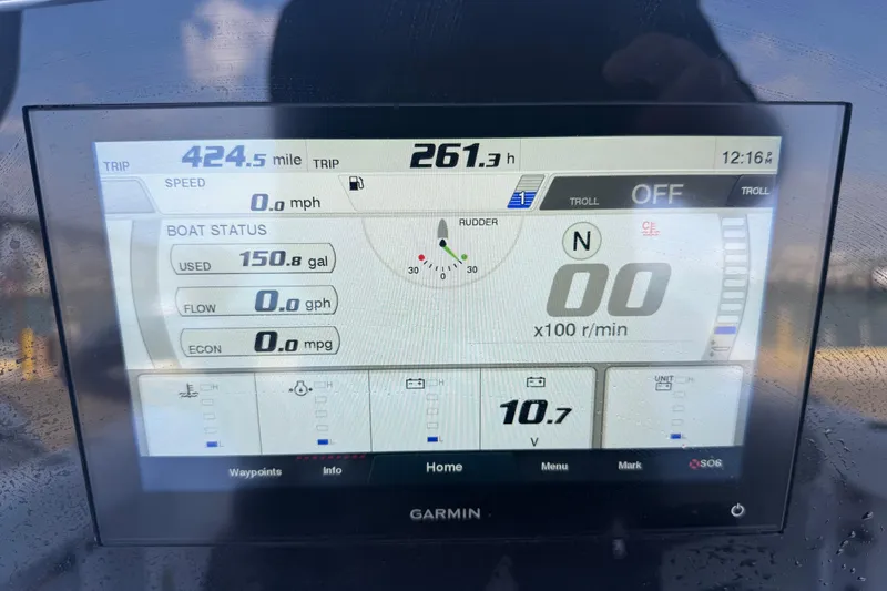 Slide: The Image of Garmin display on 2022 Sportsman Open 232 Center Console showing trip and boat status. - 21