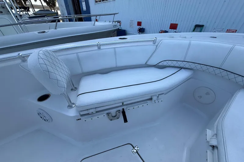 Slide: The Image of 2022 Sportsman Open 232 Center Console boat interior with cushioned seating. - 27
