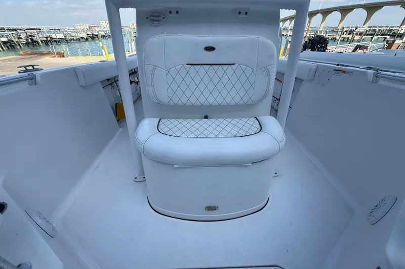 Slide: The Image of 2022 Sportsman Open 232 Center Console boat interior with cushioned seating. - 30