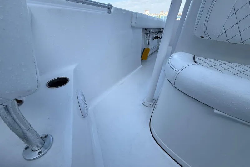 Slide: The Image of 2022 Sportsman Open 232 Center Console interior with white seating and deck details. - 34