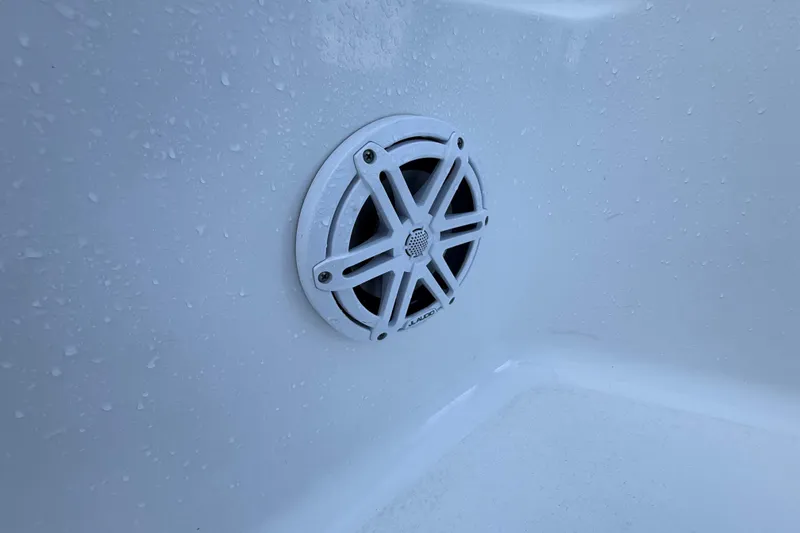 Slide: The Image of Speaker on 2022 Sportsman Open 232 Center Console boat, wet surface. - 35