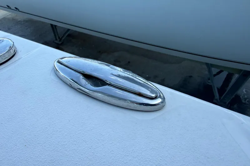 Slide: The Image of Chrome cleat on 2022 Sportsman Open 232 Center Console boat deck. - 44