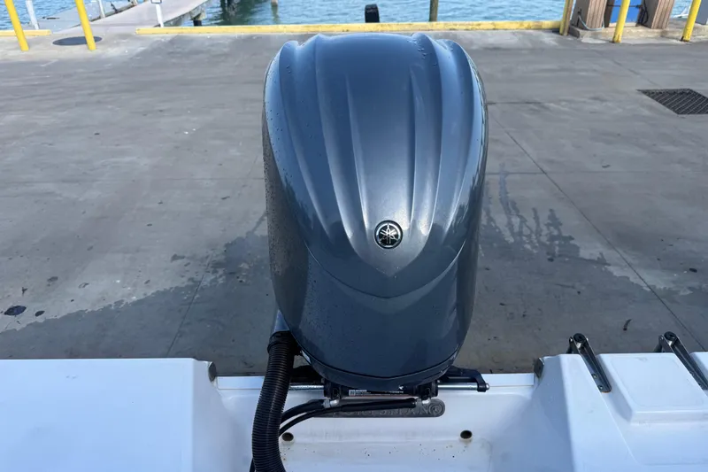Slide: The Image of 2022 Sportsman Open 232 Center Console with Yamaha outboard motor at dock. - 52