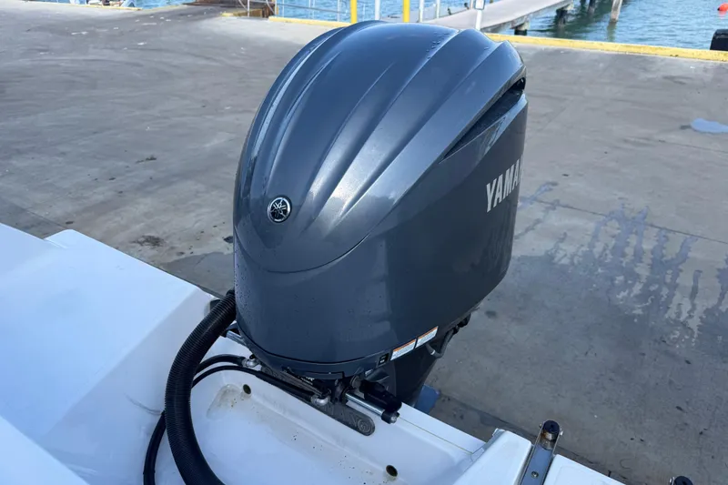 Slide: The Image of Yamaha outboard motor on 2022 Sportsman Open 232 Center Console boat at dock. - 53